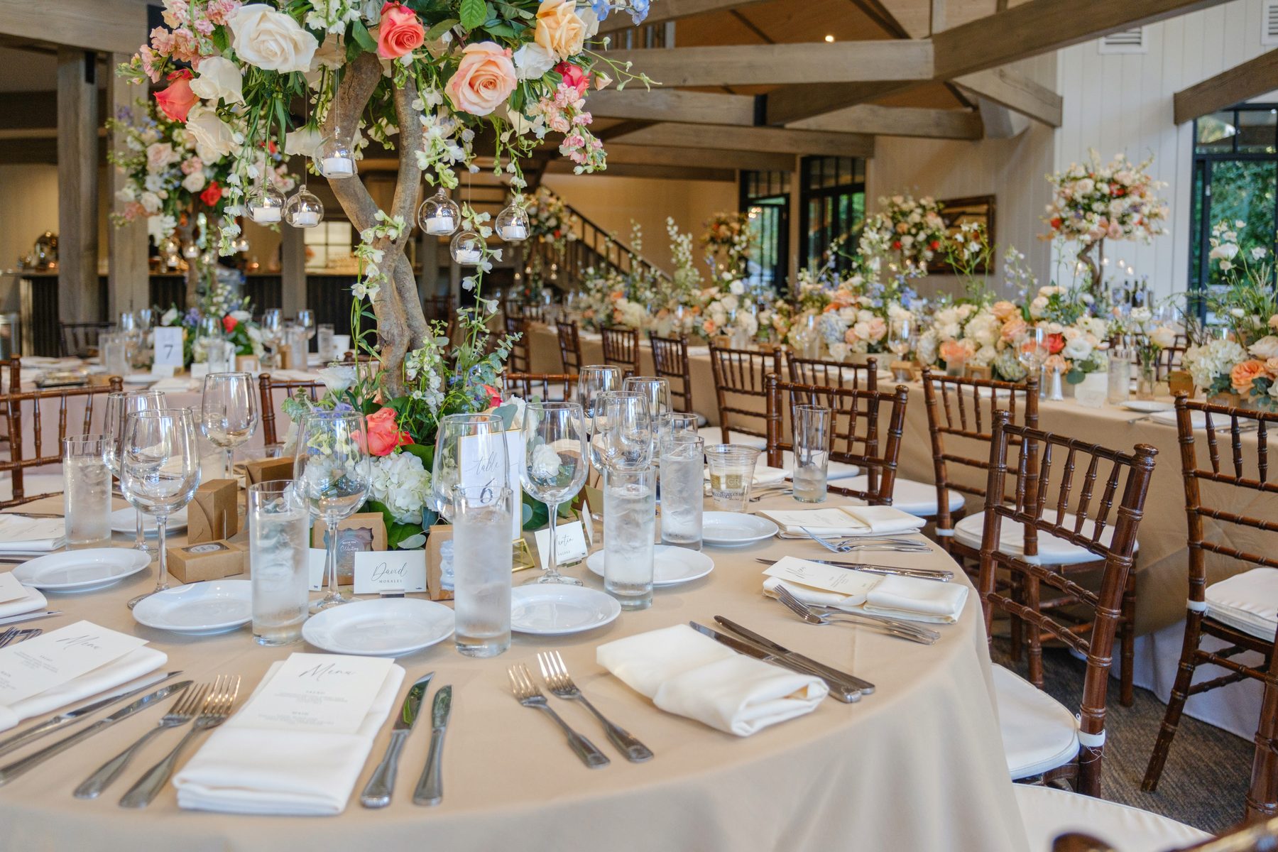 Wedding reception tablescape with floral centerpiece by Color Tree Event